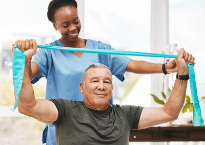 Nurse helping patient with rehabilitation exercise.