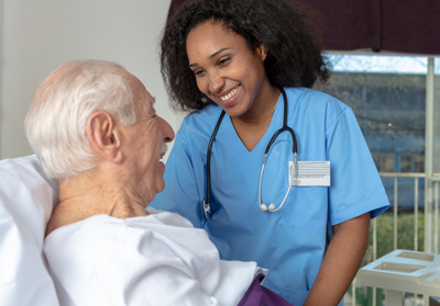 Nurse and patient laughing together
